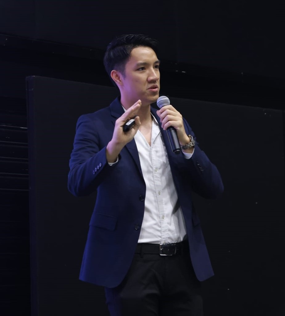 Daren Tan presenting at a technology event in Malaysia